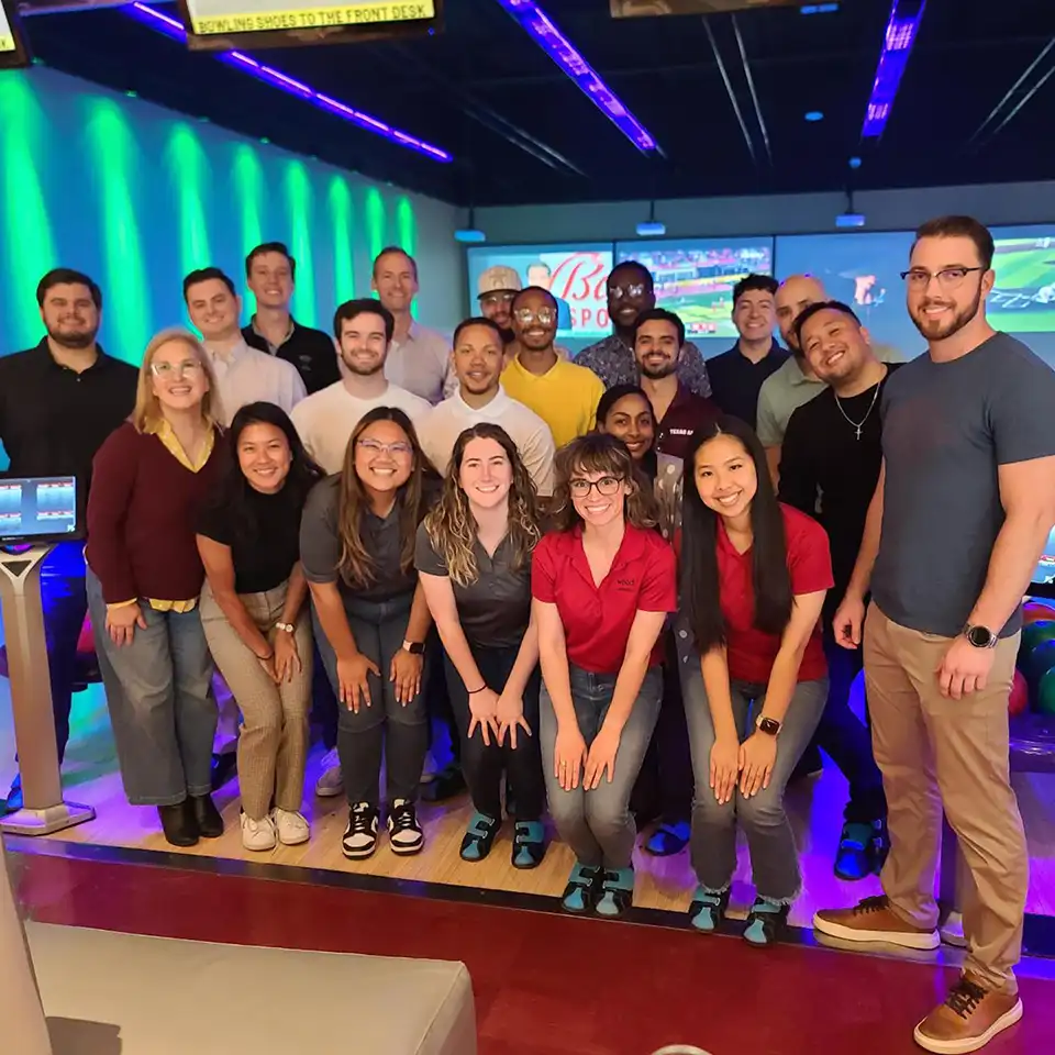 Wood employees pictured at a bowling alley
