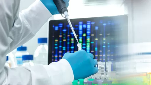 Scientist pipetting sample into a vial for DNA testing